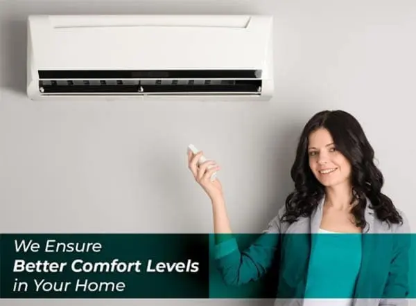 Woman Holding Remote Control of an Air Conditioner A woman is holding the remote control of an air conditioner, adjusting the settings to create a comfortable indoor environment