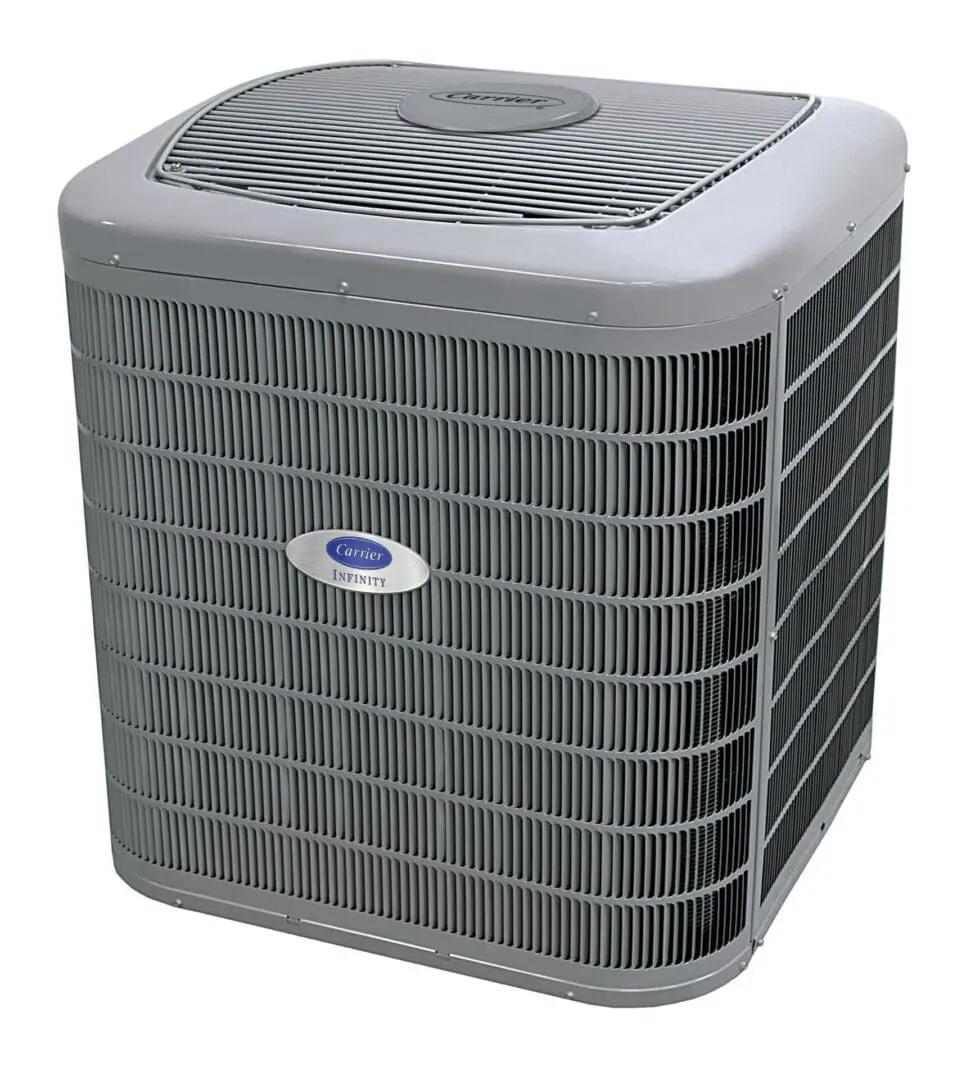 Carrier Air Conditioning Unit Installed on the Ground A Carrier air conditioning unit is installed on the ground outside a home, securely placed for optimal cooling performance