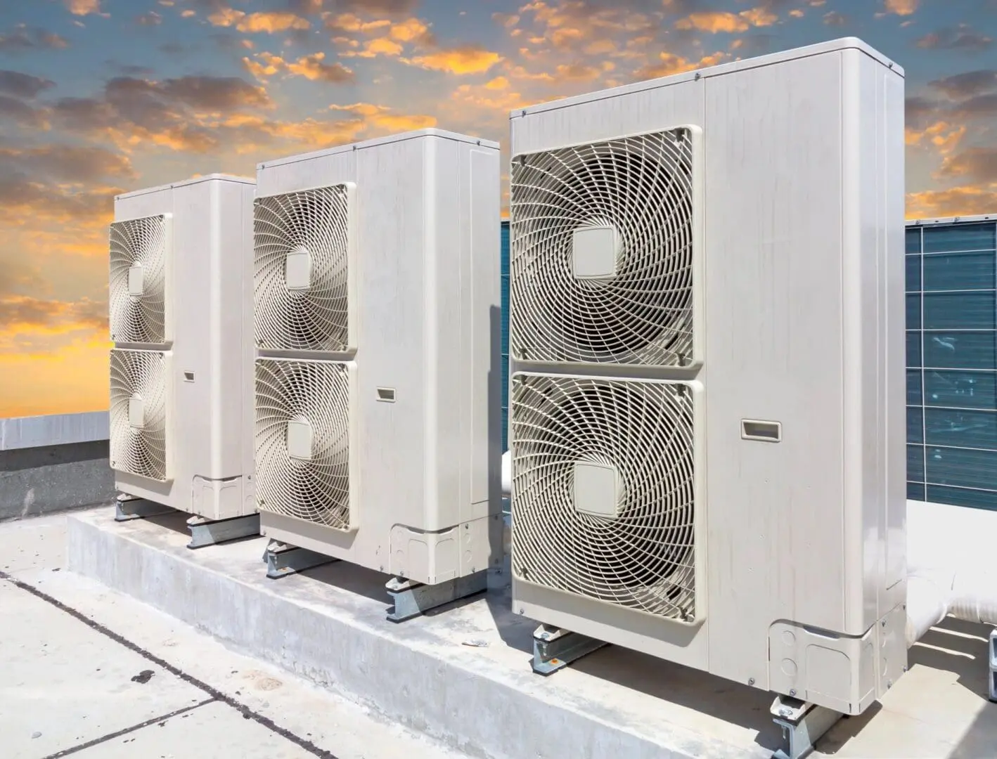 Ductless ac systems installed on a rooftop with secured brackets