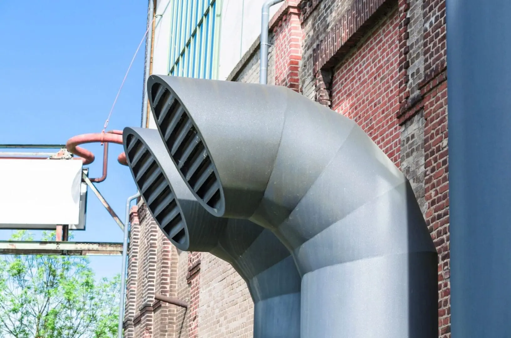 Large exhaust vents facing away from a commercial building