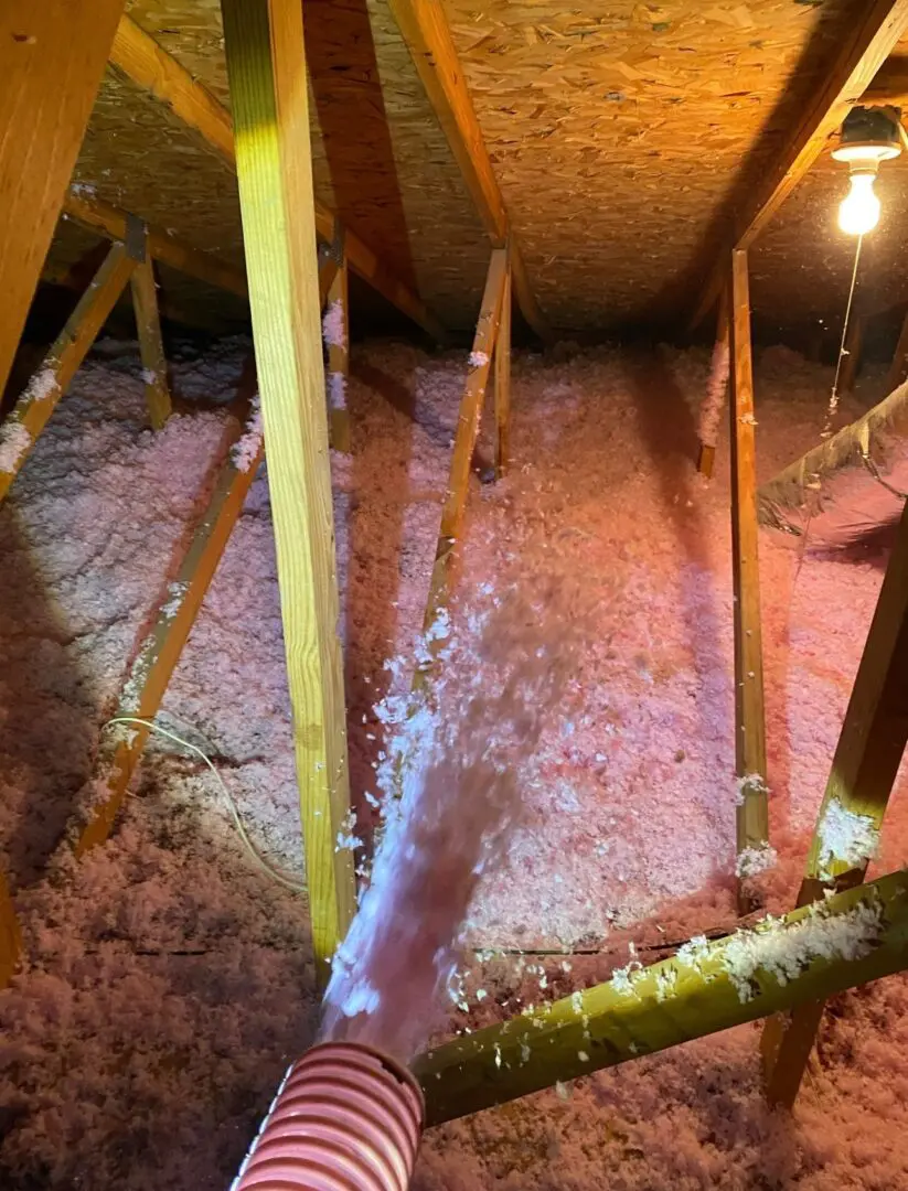 attic insulation Blown In attic Insulation being installed in Jacksonville, Florida