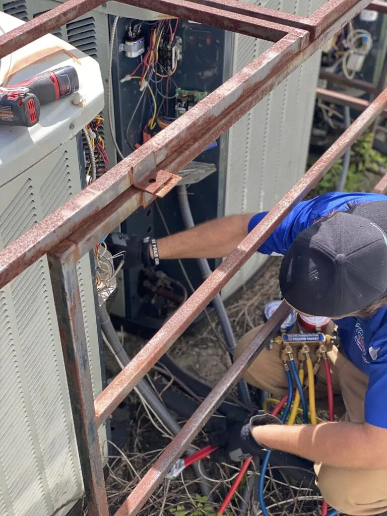 heating and air conditioning repair by a HVAC Technician