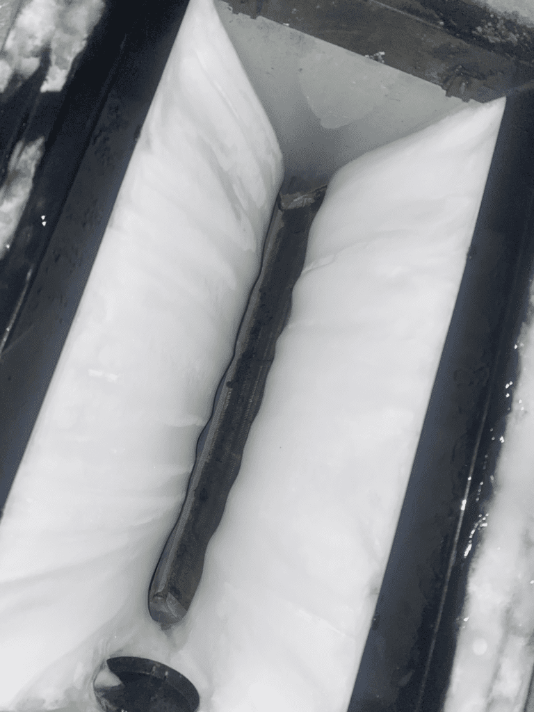 Frozen AC coil in need of repair, impacting cooling efficiency in an air conditioning unit in Jacksonville.