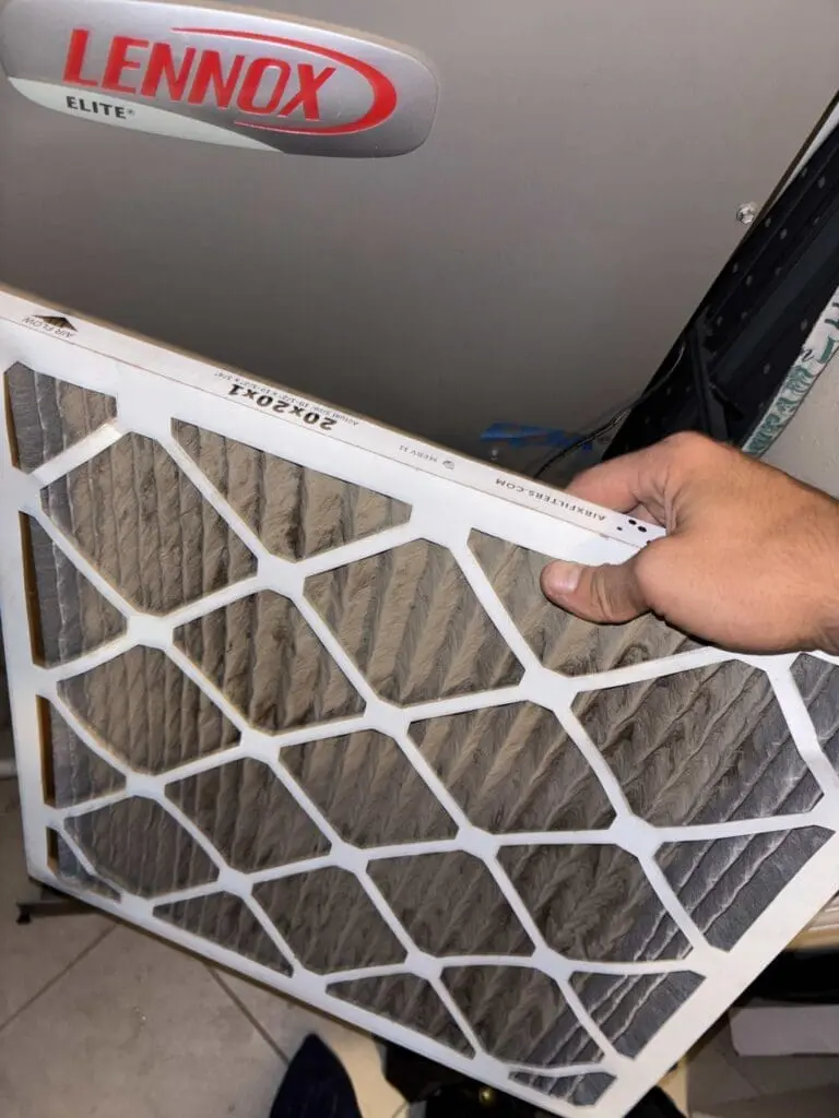 Dirty air filter during air conditioning maintenance, reducing system efficiency and impacting indoor air quality in Jacksonville.