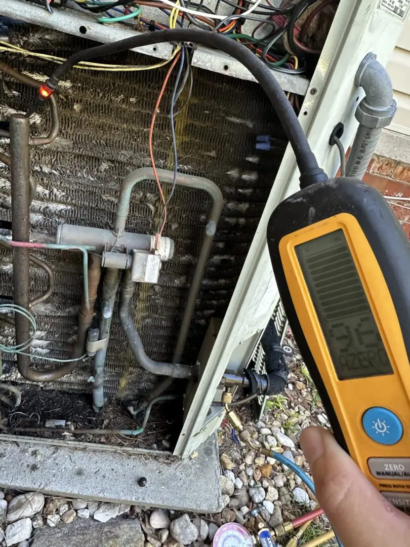 A licensed technician performing a diagnostic check to identify why an air conditioning unit stopped working during a Jacksonville heatwave.