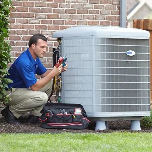A man is working on an air conditioner.