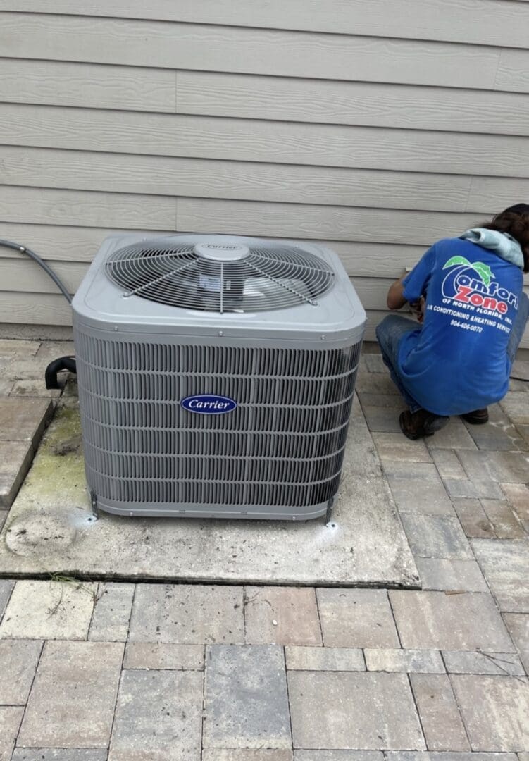 An air conditioning technician installing a new unit in Jacksonville.