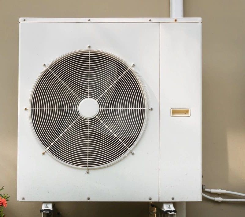 A white air conditioning unit mounted on a wall.