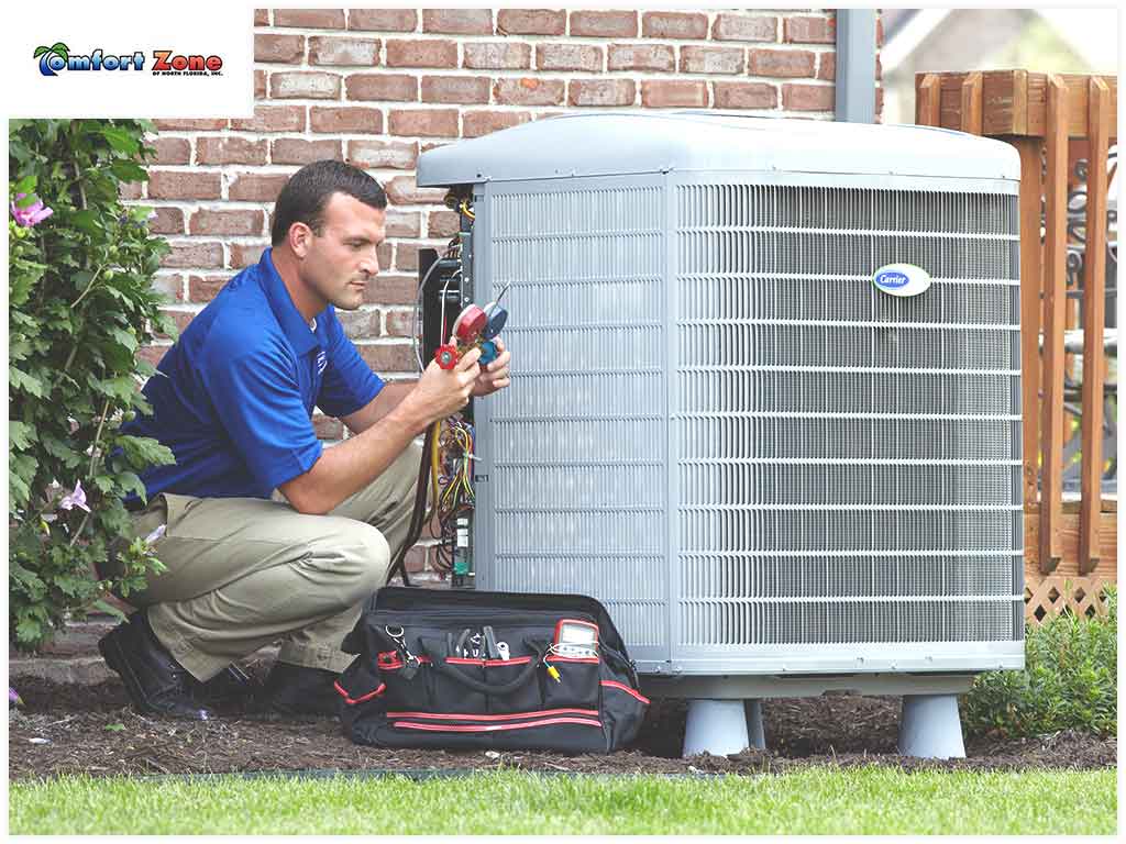 A man is working on an air conditioner