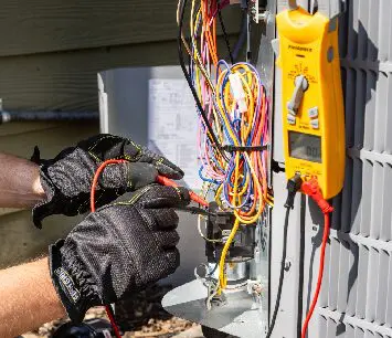 A person working on an electrical system.