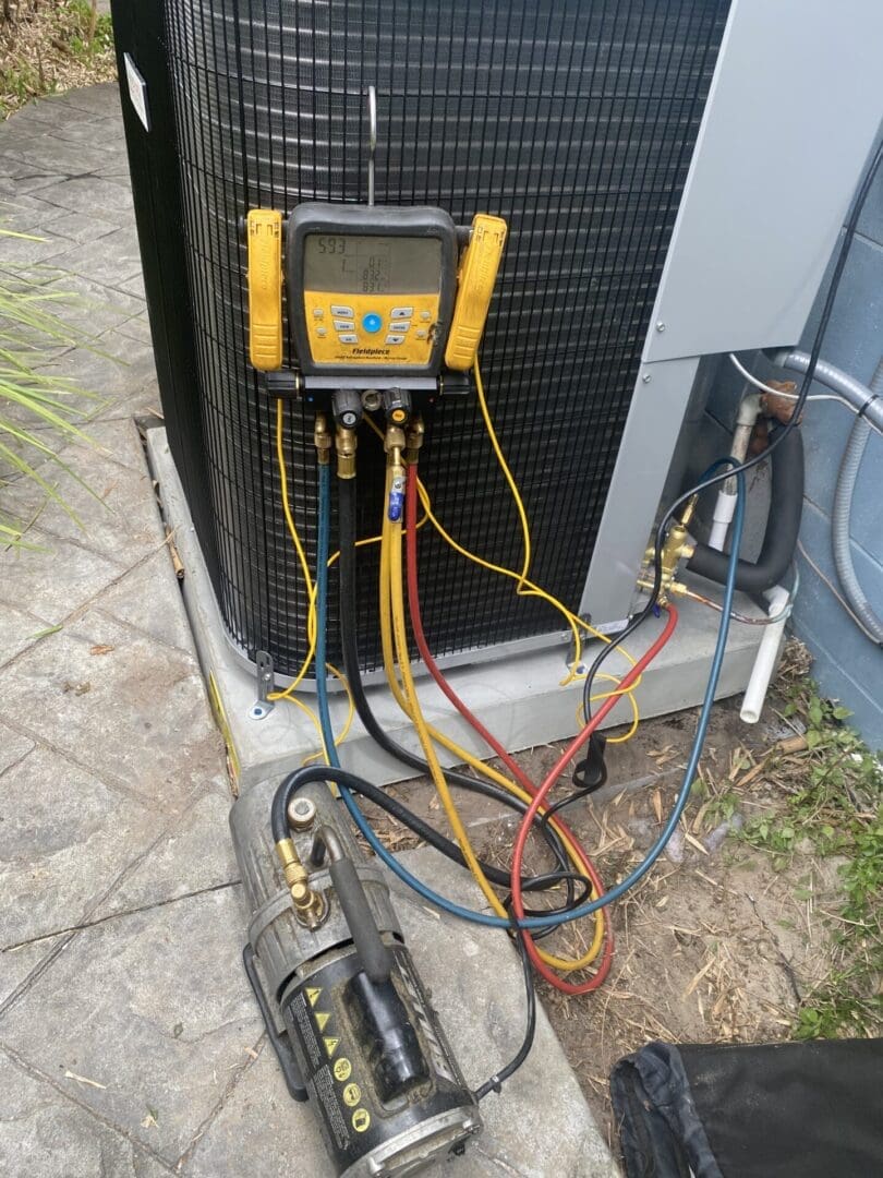 Vacuum moisture out of an air conditioning system with digital guages.