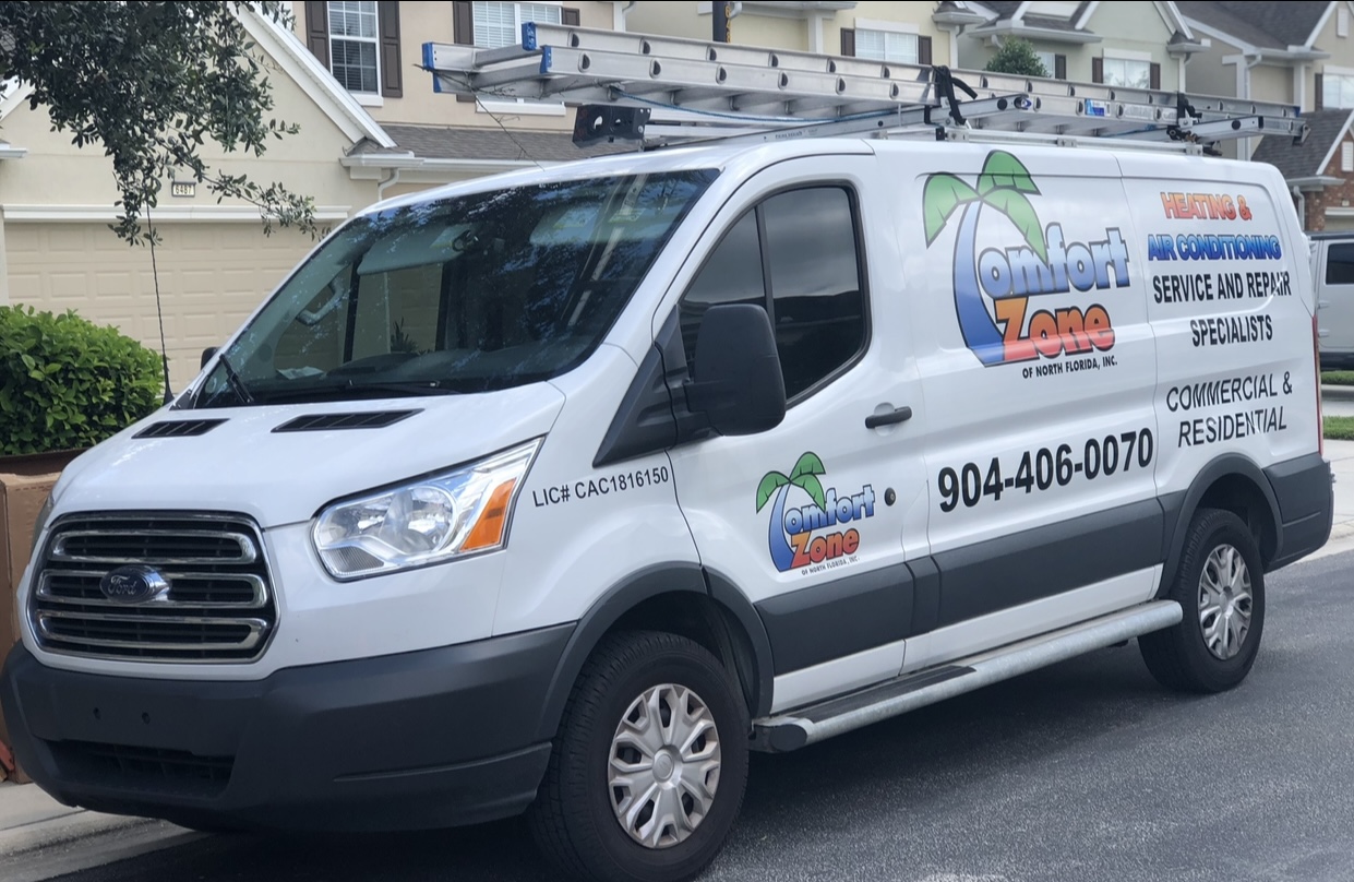 A Comfort Zone of North Florida Inc. service vehicle arriving at a Yulee residence to perform routine HVAC servicing.