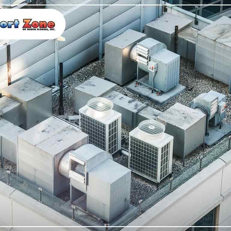 Aerial view of multiple commercial hvac units on a building rooftop.
