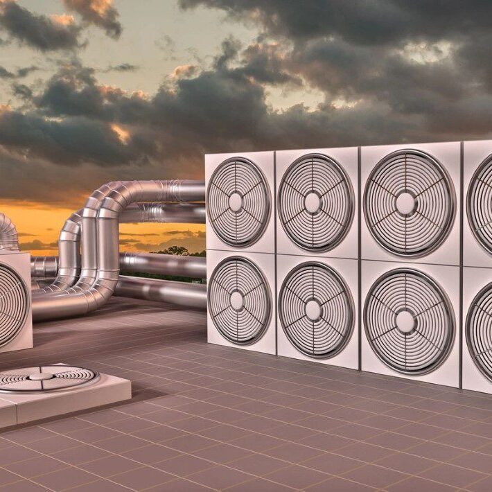 A bunch of air conditioners are on the ground